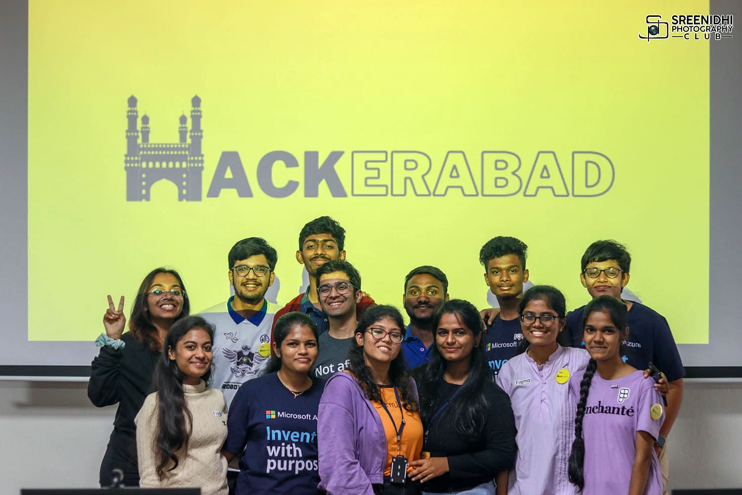 The Hackerabad organising team standing in front of the community logo